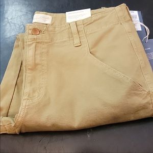 Woman’s 14 W high rise slim straight tan jeans.  Smooths and sculpts.